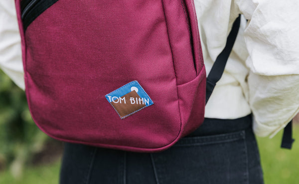 A close shot of the classic Moon TOM BIHN Logo.
